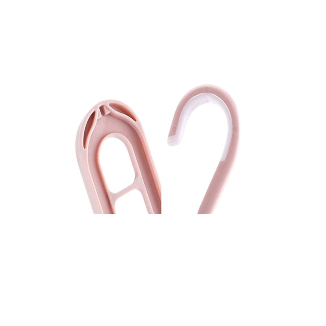 Space saving hanger organizer in soft pink color, designed to hold multiple garments and keep clothes wrinkle-free.